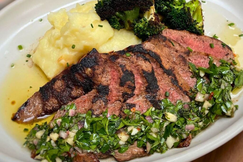 Flat iron steak with mashed potatoes and charred broccoli