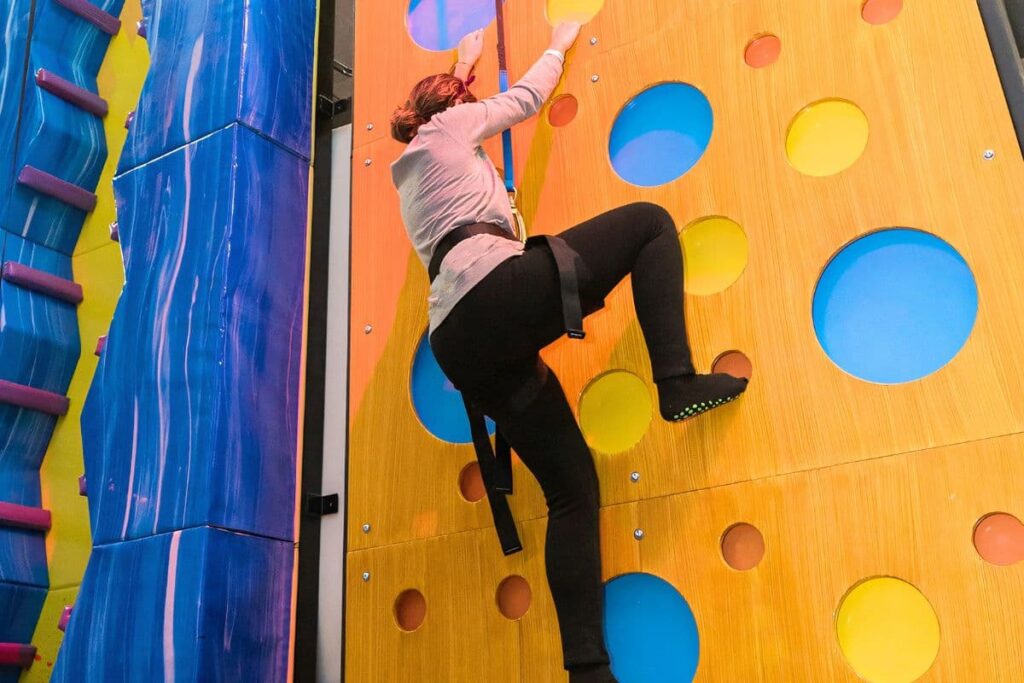 Orange climbing wall at Urban Air