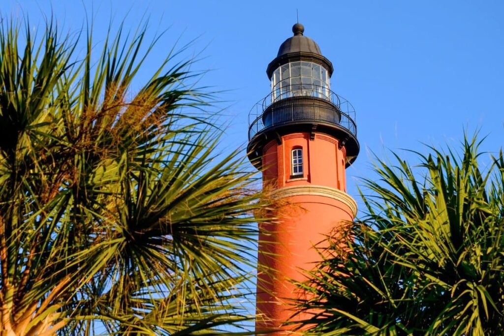 Ponce de Leon inlet lighthouse between palm trees