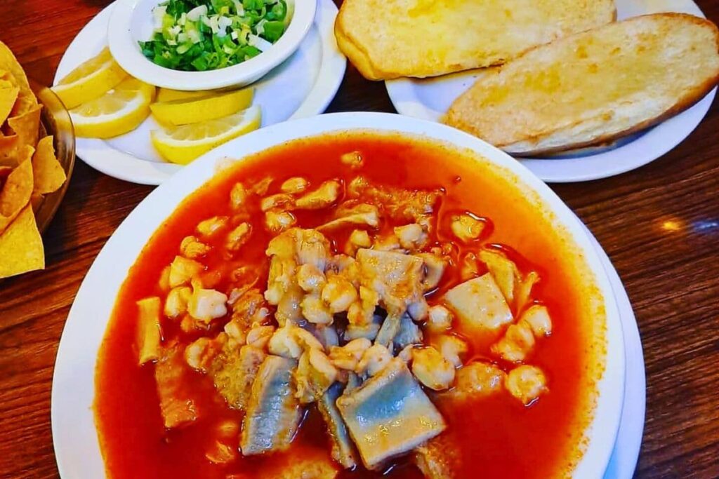 Red Menudo soup with birote