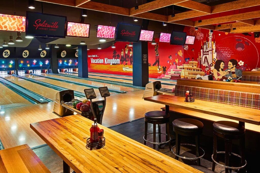 Splitsville bowling lanes and long bench tables to dine