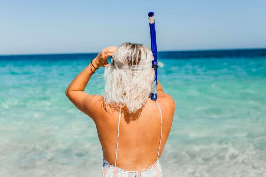 Woman getting ready to go snorkeling