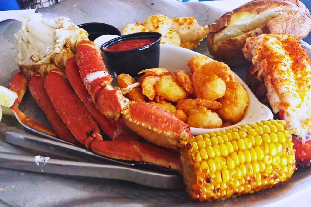 Dockside Dinner broiled lobster tail, baked scallops, steamed crab legs, and shrimp