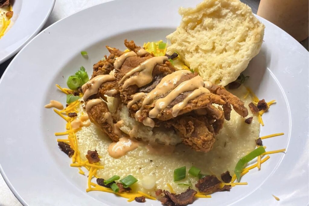 Softshell Crab Sandwich served over Cheese Grits