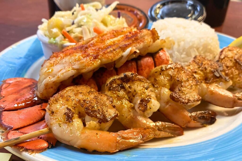 Twisted Lobster shrimp and lobster combo with coleslaw and rice